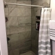 These 12x24 tiles give this smaller shower a bigger feel!